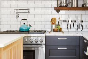 white subway tile backsplash and pot filler