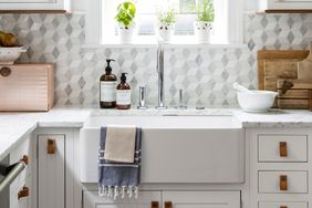 white kitchen sink with gray diamond backsplash