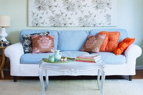 Two-toned sofa with blue cushions and white structure