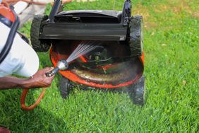 washing lawn mower blades with hose