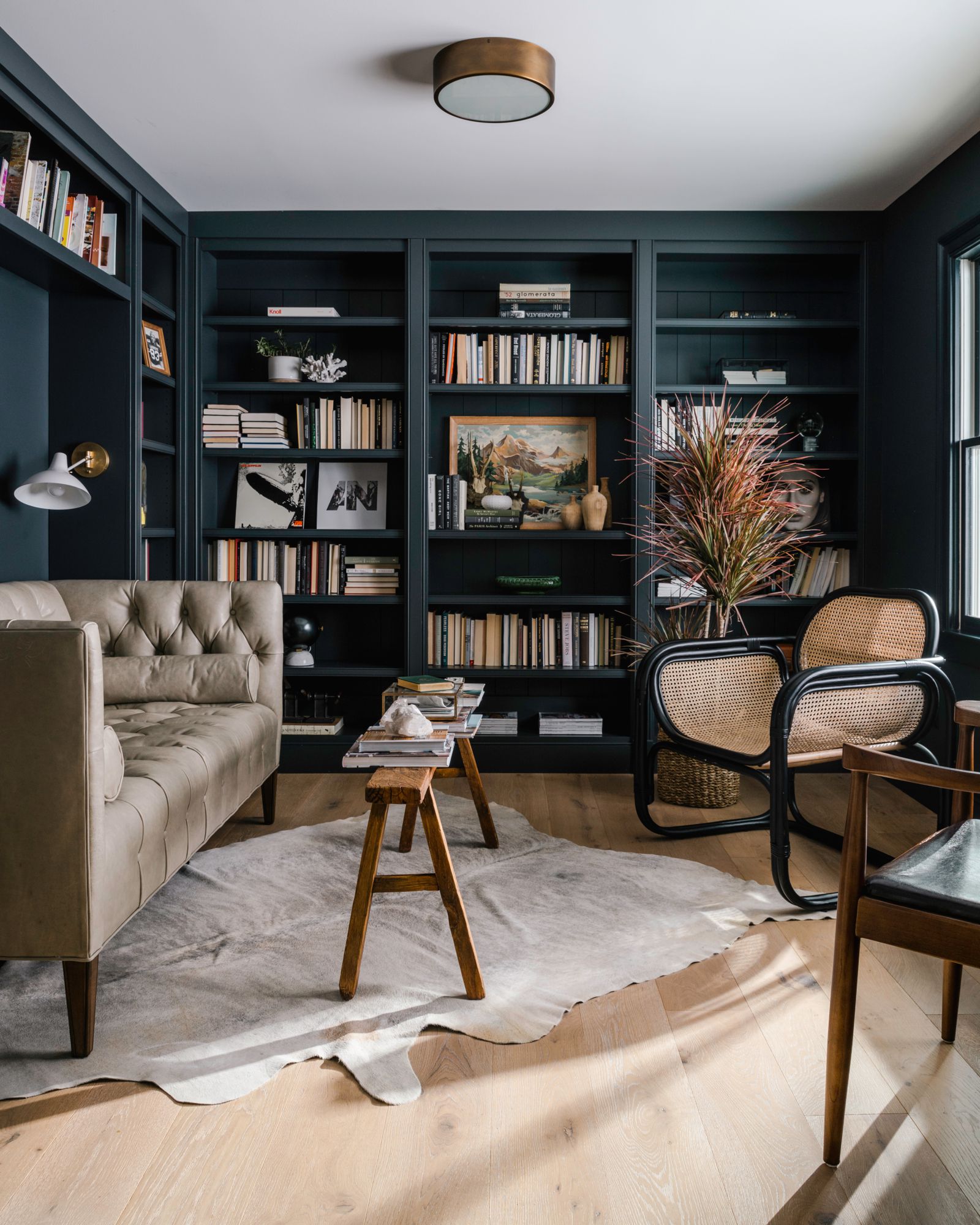 living room with black built in shelves wall