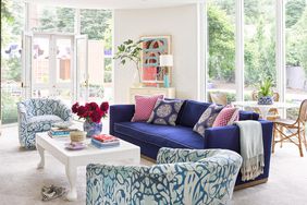 Living room with graphic chairs and blue sofa