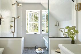 wet room bathroom with freestanding tub and walk-in shower