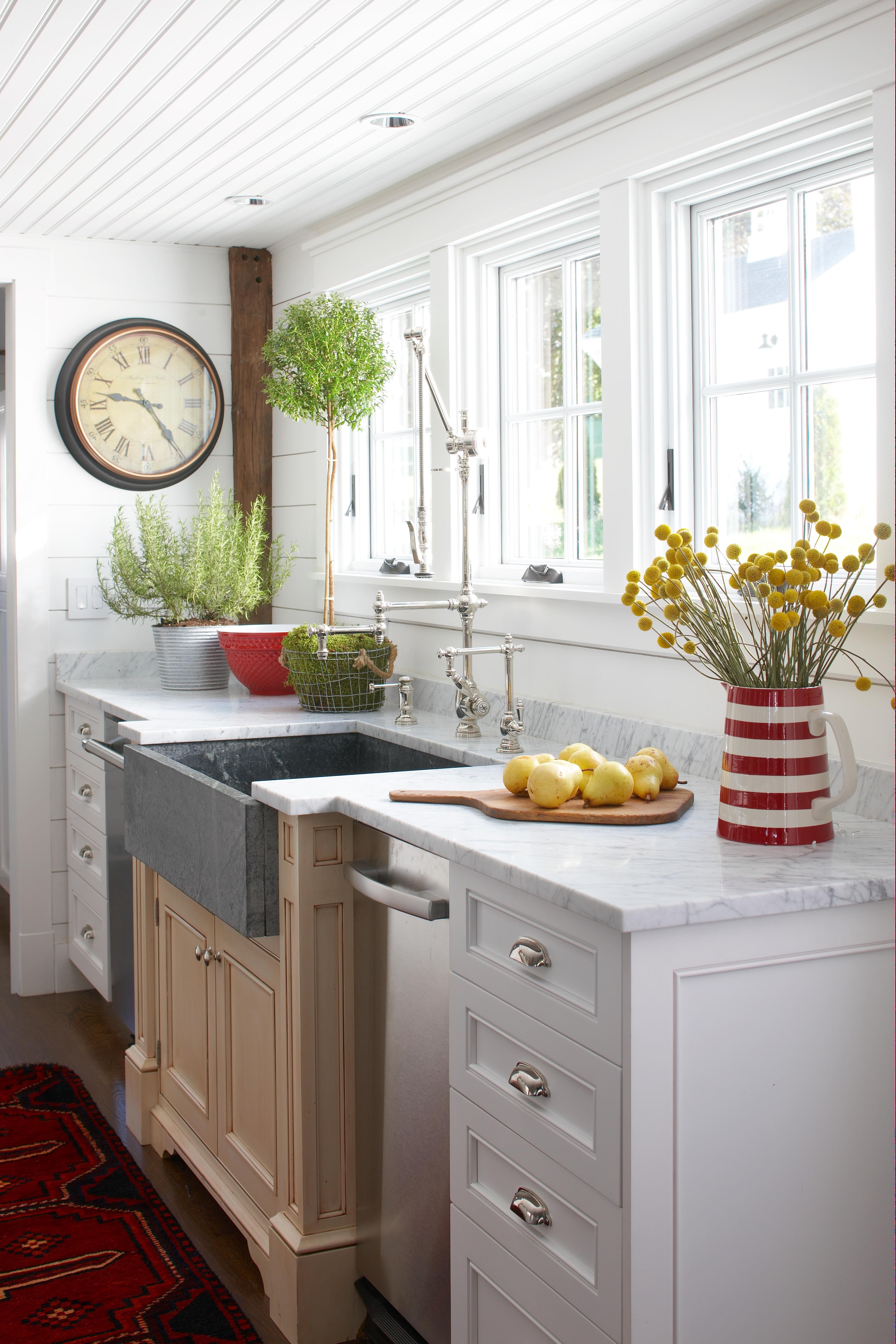 remodeled kitchen sink marble countertop with three windows