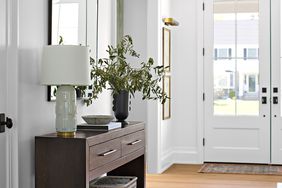 Foyer with table and lamp.