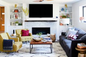 living room with yellow chairs blue couch