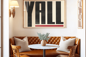 word art yall above leather dining room banquette and bistro table