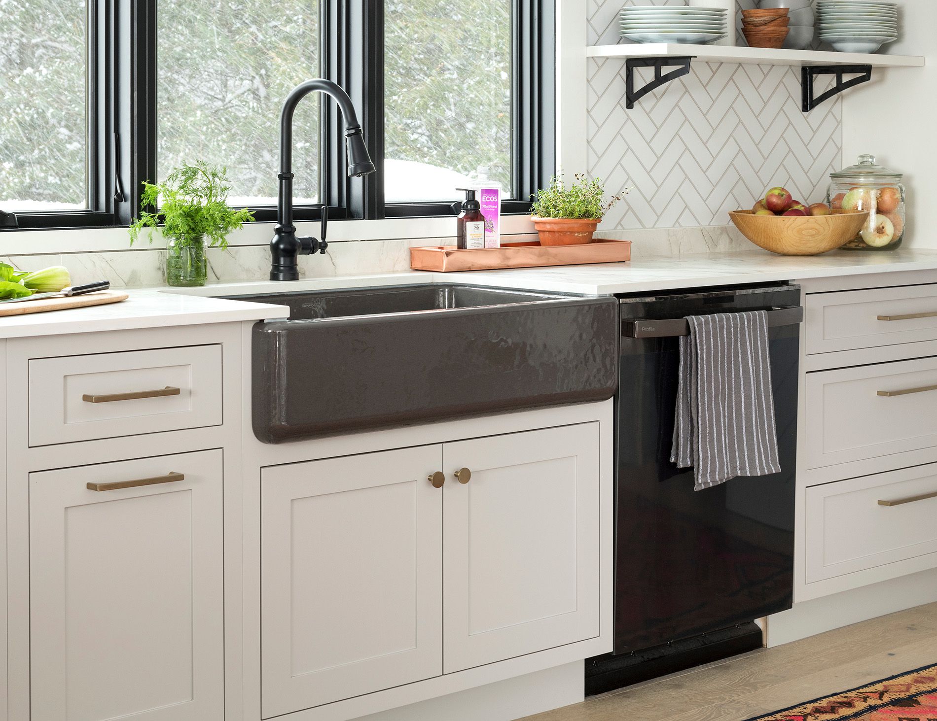 white kitchen cabinets and gray sink