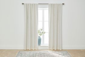 A set of blackout curtains we recommend hanging over a window