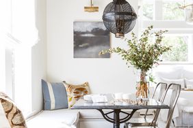 dining area with metal chair and banquette seating