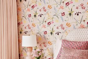 bedroom with pink wallpaper and pink bedding