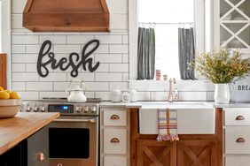 Kitchen with wooden floors and white tile