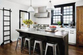 black and white kitchen with stainless steel island