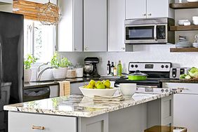 modern light gray kitchen marble island with brass stools