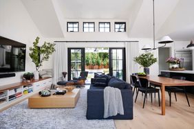 Open concept living room with blackout curtains