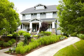 Gray house with garden front yard