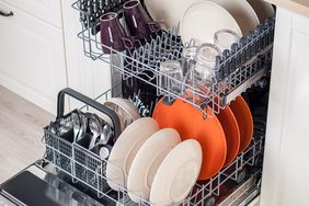 dishwasher open with colorful dishes