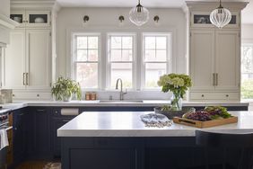 colonial kitchen with black island and white cabinets