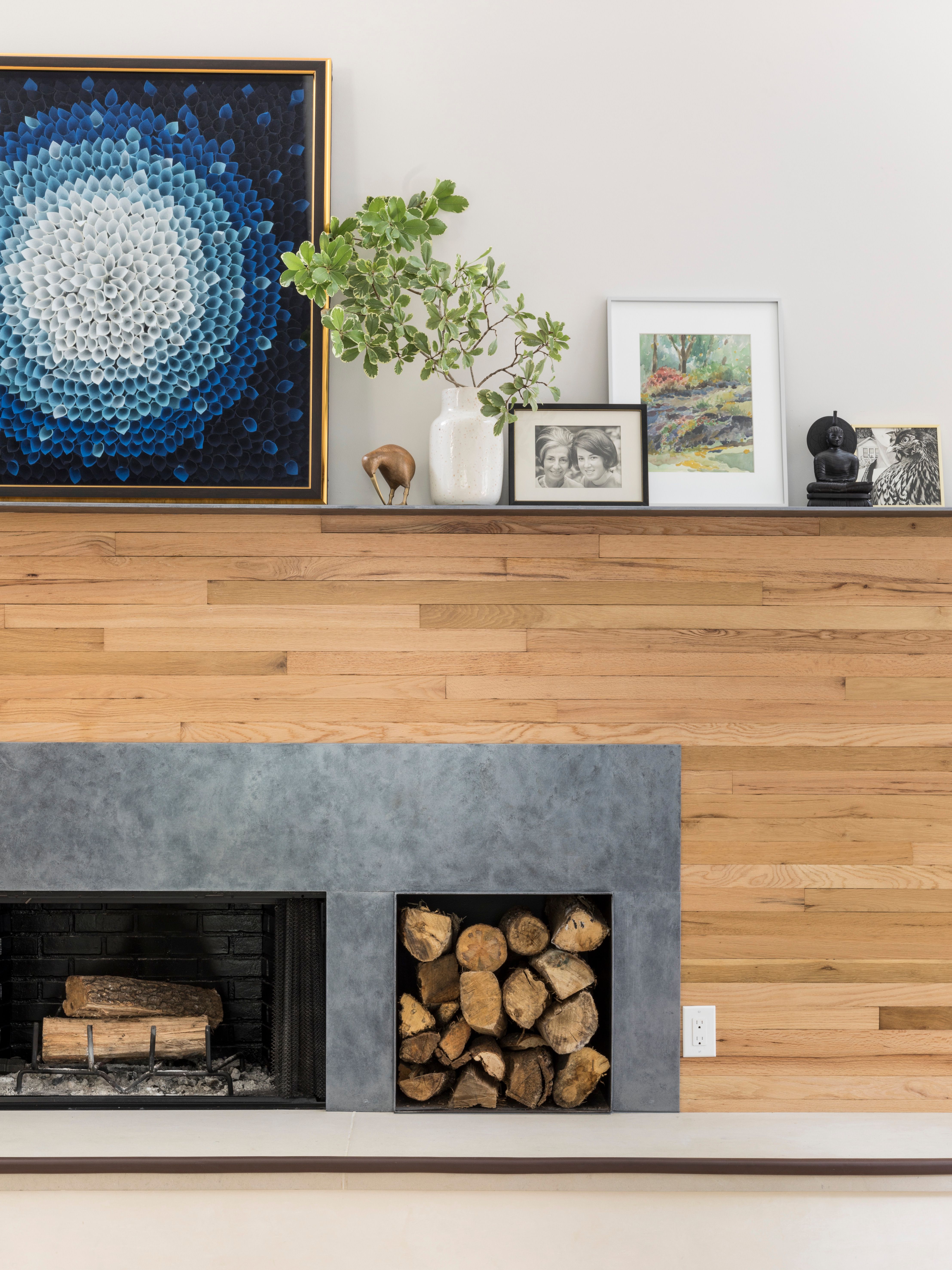 contemporary fireplace with wood slats on wall around fireplace surround with contemporary decor on mantle