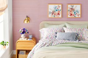 spring themed bedroom with made bed and BHG Walmart sheets and blankets