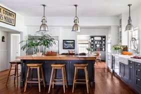 blue kitchen cabinets with cherry wood floor