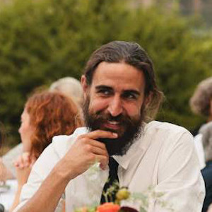 Picture of podcast guest Stephen O'Grady, dark hair, beard, white shirt.