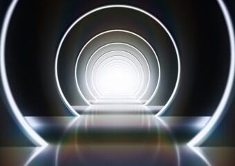 3D rendering of concentric rings in neon white light, similar to walking into a tunnel or portal.