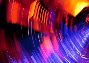 Image of an abstract lighting effect, revealing various shades of red, purple, blue, pink, and yellow.