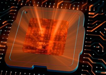 Digitally generated image of CPU chip on motherboard with its center emitting orange light outward.