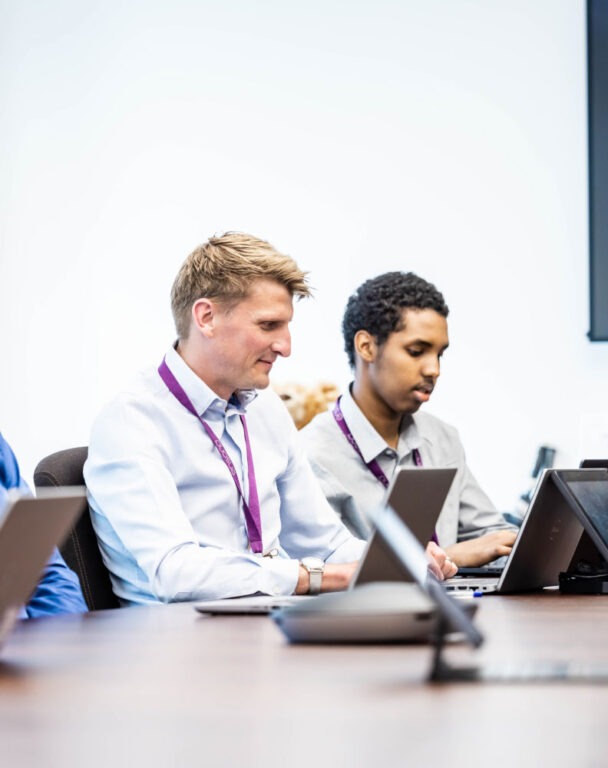 Two people working in a bright office