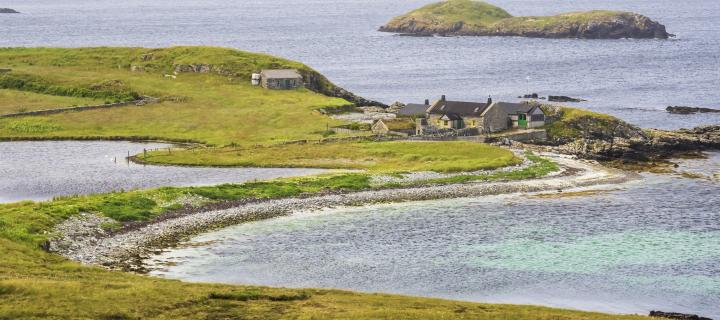 A croft house on the coast at Ling Ness, South Nesting, Shetland, Scotland, UK