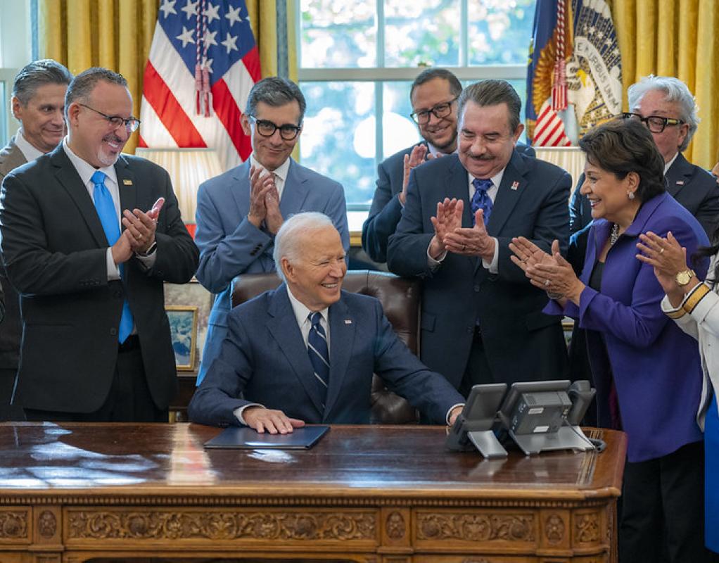 Guests applaud during a ceremonial signing of an Executive Order by President Joe Biden that advances educational and economic opportunities for Latino communities across the country.