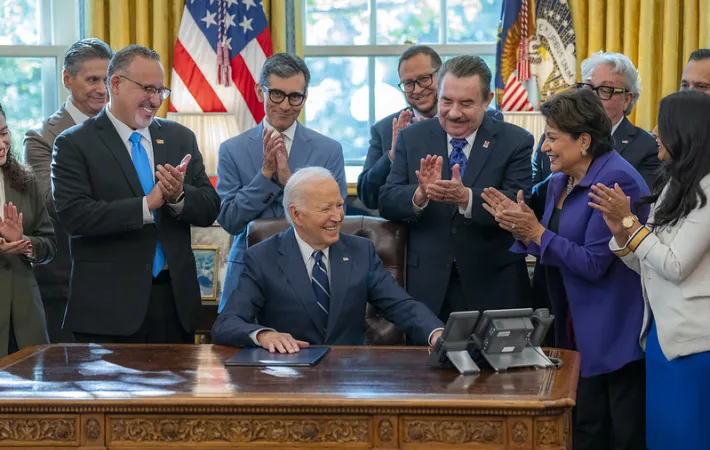 Guests applaud during a ceremonial signing of an Executive Order by President Joe Biden that advances educational and economic opportunities for Latino communities across the country.