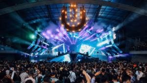 crowd near stage with light beams