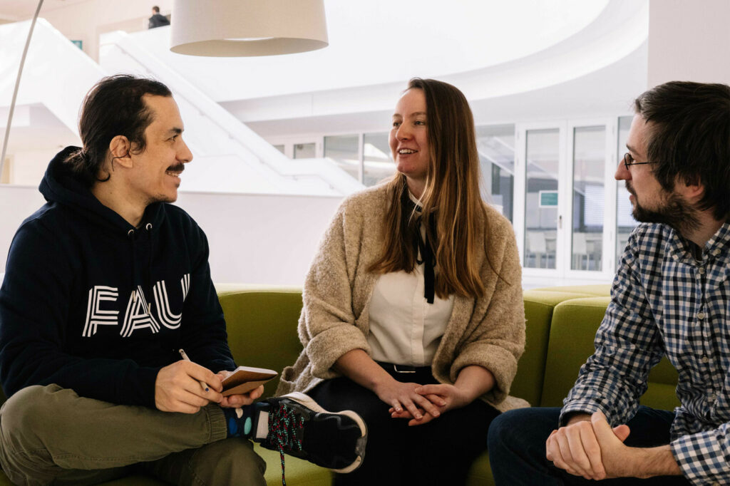 Three people talking