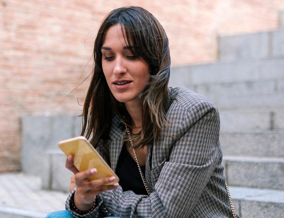 Woman looking at her mobile phone