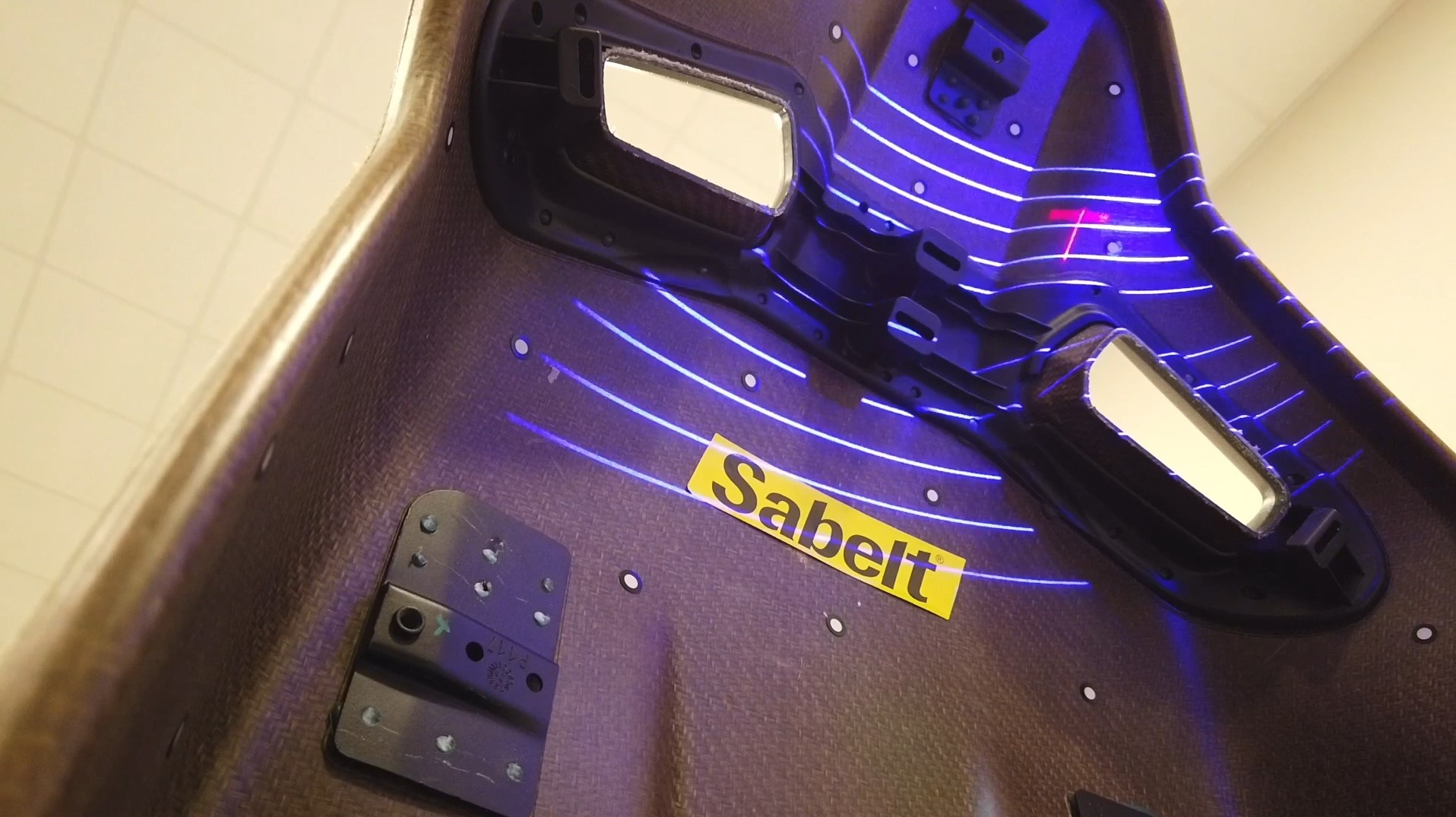 Blue laser lines on a racing car seat