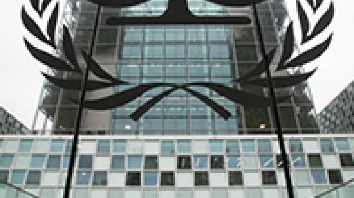 The International Criminal Court logo shows in front of building. 