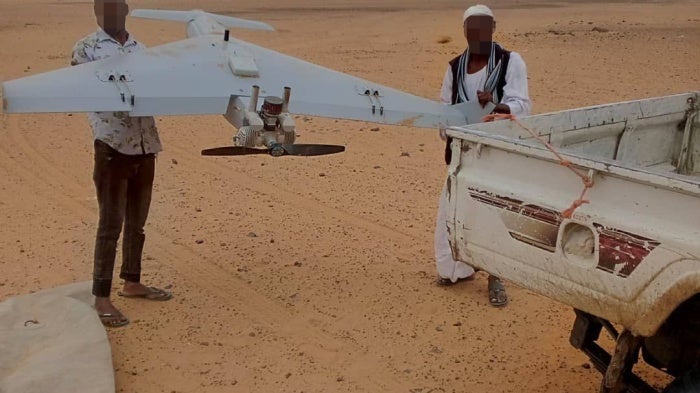  Sudanese armed forces with an unexploded, one-way attack drone from the Rapid Support Forces recovered from an attack on a government building in Gedaref, Sudan, July 11, 2024. 