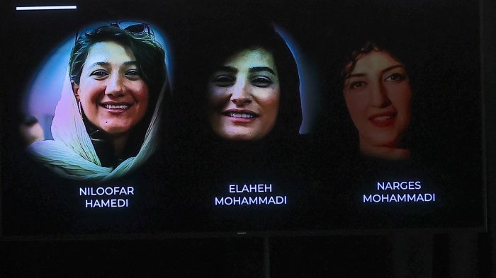 Three imprisoned Iranian female journalists, Niloofar Hamedi (L), Elaheh Mohammadi (C) and Narges Mohammadi during the award ceremony of the UNESCO/Guillermo Cano World Press Freedom Prize.