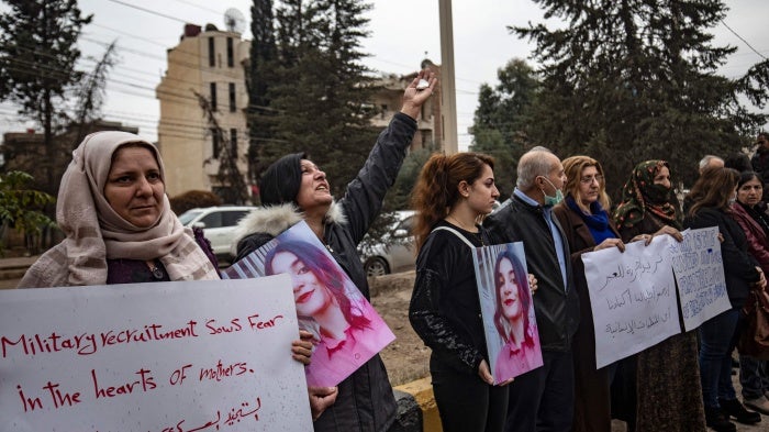 Syrian Kurds demonstrate outside a UN building, calling on WHICH??authorities to help obtain the release of girls abducted and recruited into fighting, in the northeast city of Qamishli, November 28, 2021.