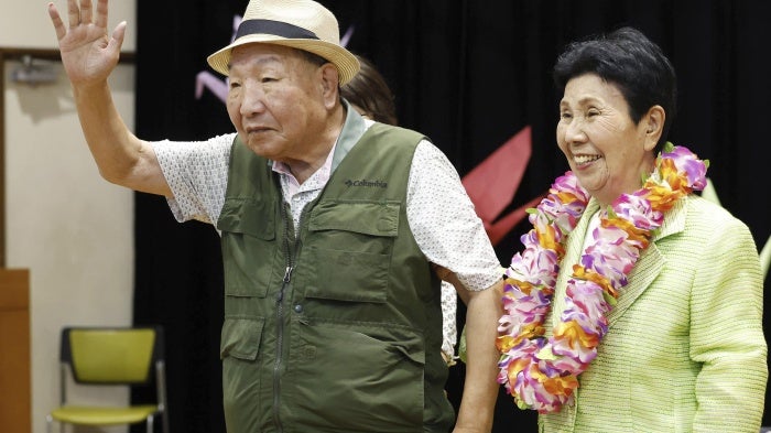 Iwao Hakamata waves to supporters while meeting with his sister Hideko, several weeks after his acquittal on retrial for the 1966 murder of a family of four, in Shizuoka, Japan, October 14, 2024.