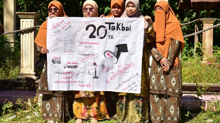 Community members call for justice at a mass grave for victims of the October 2004 Tak Bai massacre, Narathiwat, Thailand, October 25, 2024.