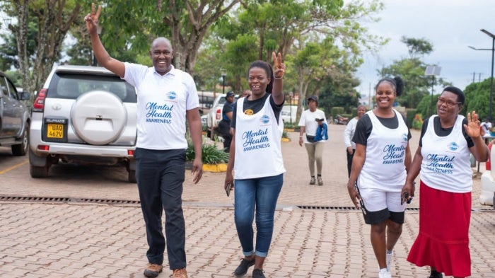 Benon Kabale, left, participates during an event on mental health awareness during the Lubowa Community and Toastmasters Mental Health Run/Walk on November 2, 2024, in Lubowa, Kampala.