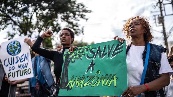 Environmentalists protesting in the streets. 