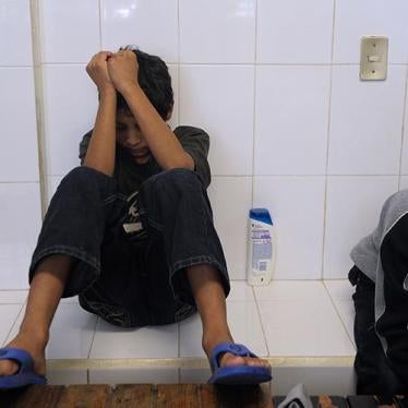 A 12-year-old Salvadoran boy rests as he waits to be deported, at the National Immigration Institute, in Comitan, Chiapas, Mexico on August 19, 2010. ©2010 Jose Cabezas/AFP/Getty Images