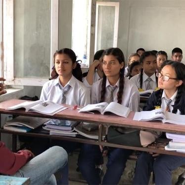 A sign language teacher translates a lesson to students with disabilities in an inclusive class.