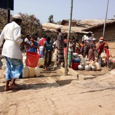 Rohingya refugees place empty jars in a line while waiting to collect water in Cox's Bazar, Bangladesh on April, 20, 2020. 