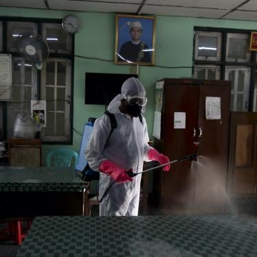 A city worker disinfects government offices as a preventive measure against the coronavirus, Yangon, Myanmar, March 25, 2020.