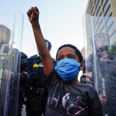 A young boy raises his fist during a demonstration in Atlanta, Georgia, May 31, 2020.